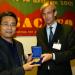  Mr. Herald Voorneveld (Netherlands) presenting a SACMEQ research medal to Mr. Yanhong Zhang (China).